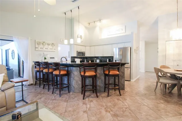 a dining room with furniture and window