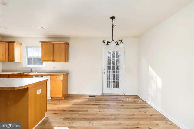 a view of a kitchen with a sink cabinets and a window