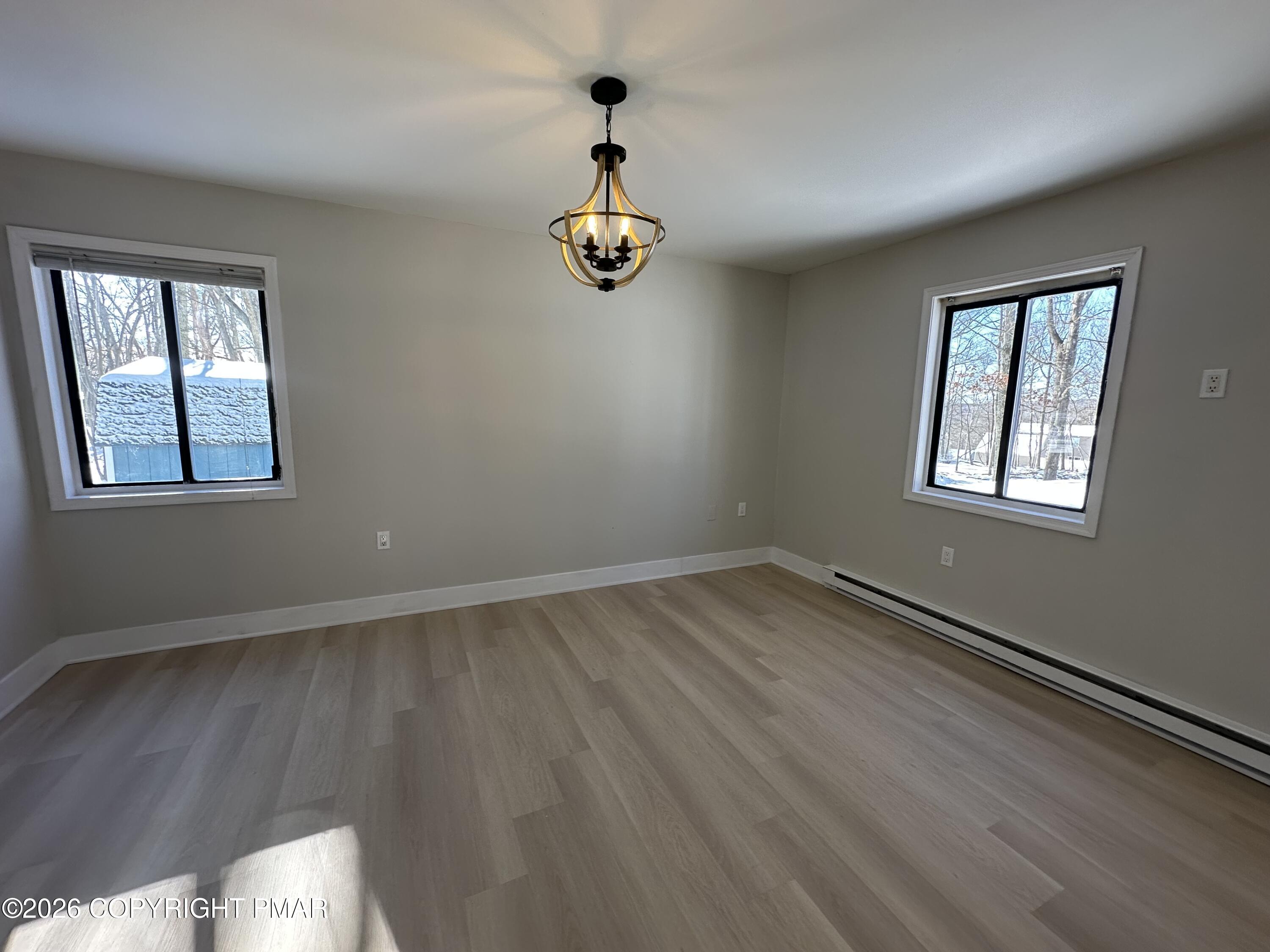 147 Pocono Boulevard Bushkill, PA 18324 - Photo 15 of 28 a view of an empty room with wooden floor and a window