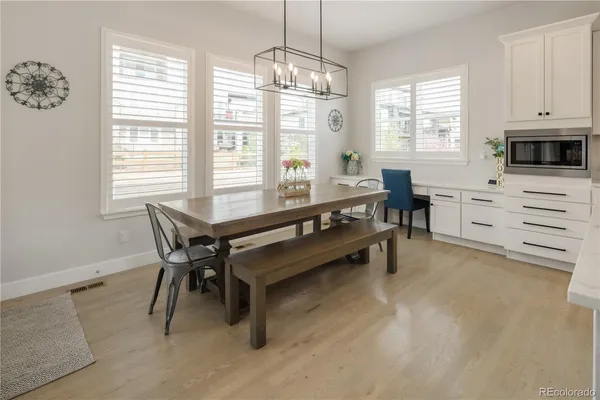 a dining room with furniture and window