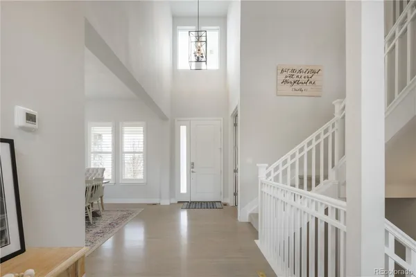 a view of an entryway with wooden floor