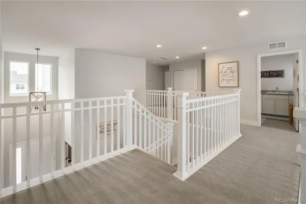 a view of a hallway with a livingroom