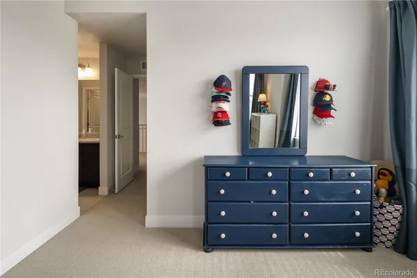 a view of a hallway with cabinet