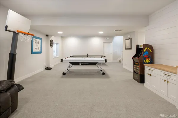 a view of a livingroom with furniture and a flat screen tv