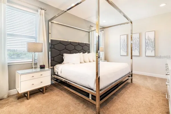 a bed room with a bed and a window