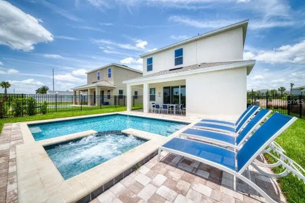 a view of a house with a swimming pool
