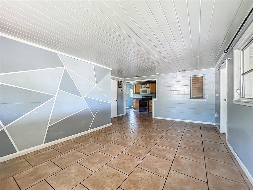 1025 South Central Avenue Lakeland, FL 33815 - Photo 39 of 42 a view of an empty room with stairs and a window