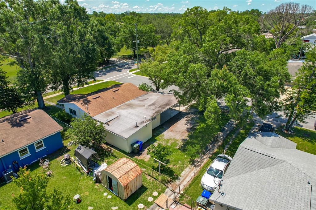 1025 South Central Avenue Lakeland, FL 33815 - Photo 4 of 42 an aerial view of a house with a yard basket ball court and outdoor seating