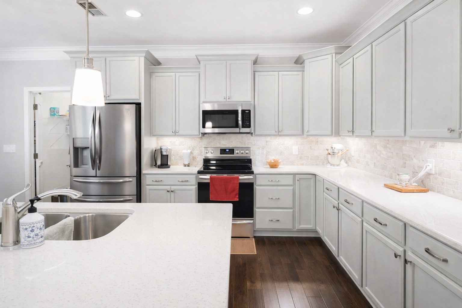 2519 Bridgeway Street Murfreesboro, TN 37128 - Photo 8 of 18 a kitchen with stainless steel appliances a sink a stove a refrigerator a center island and cabinets