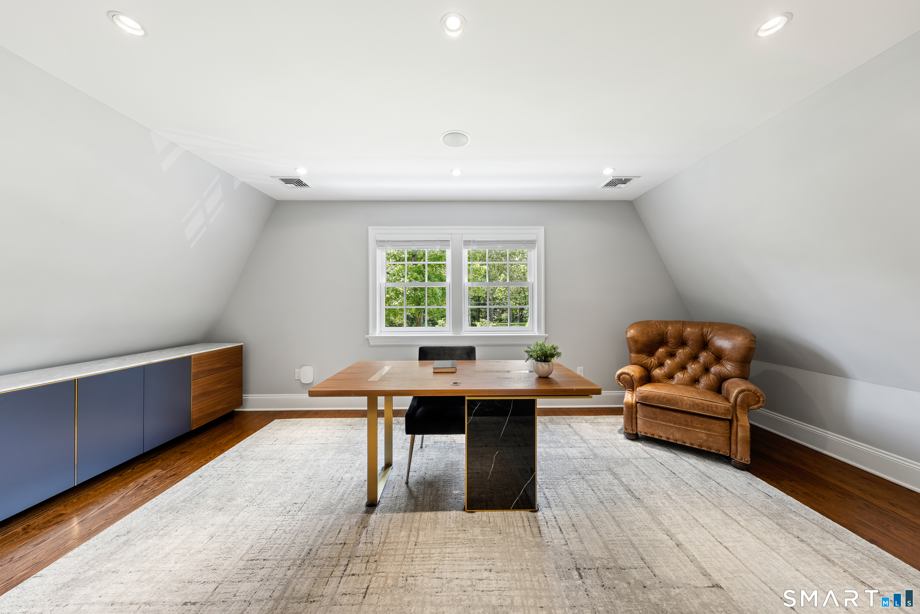 99 Hickok Road New Canaan, CT 06840 - Photo 24 of 39 a view of a workspace with furniture and window