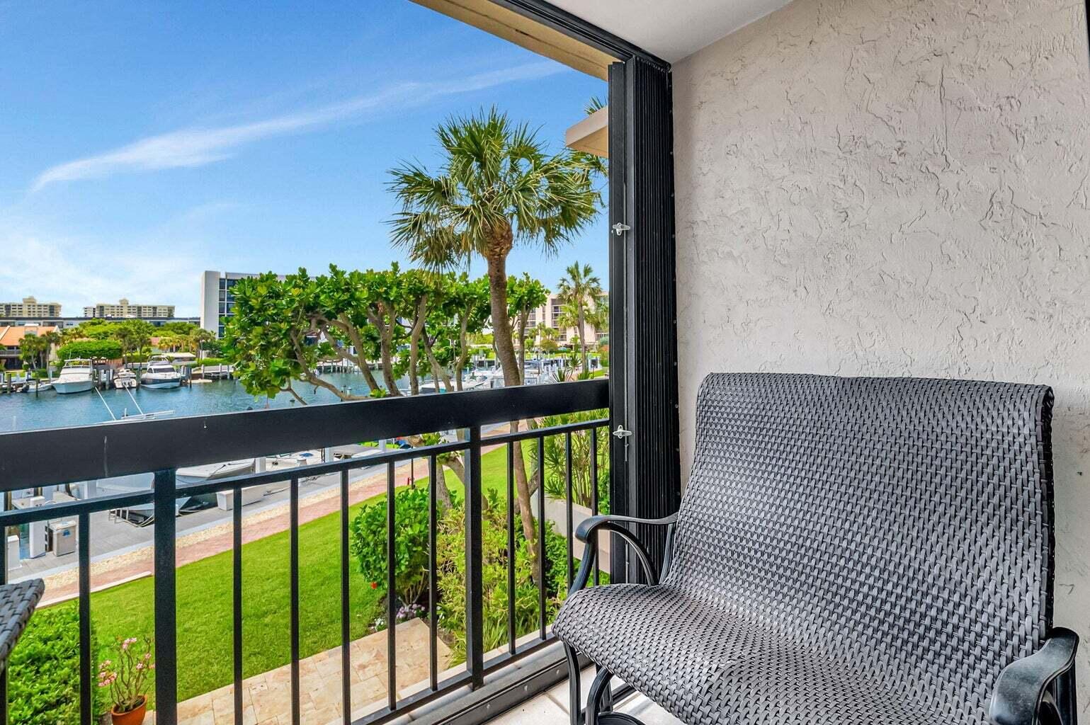 2707 North Ocean Boulevard, Unit D205 Boca Raton, FL 33431 - Photo 13 of 51 a view of a balcony with chairs