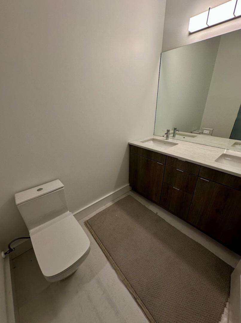 4243 North Damen Avenue, Unit 1R Chicago, IL 60618 - Photo 15 of 38 a bathroom with a sink and a toilet