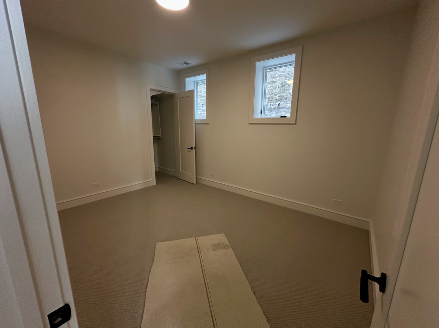 4243 North Damen Avenue, Unit 1R Chicago, IL 60618 - Photo 22 of 38 an empty room with windows and closet
