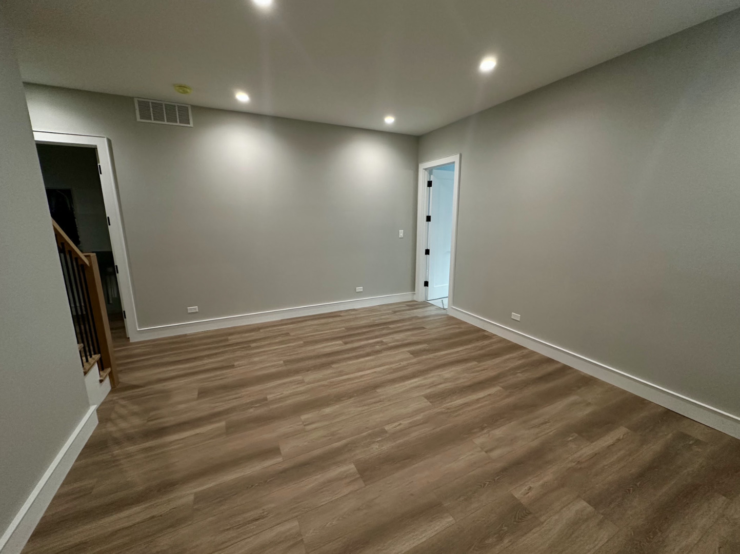 4243 North Damen Avenue, Unit 1R Chicago, IL 60618 - Photo 28 of 38 an empty room with wooden floor and sliding door