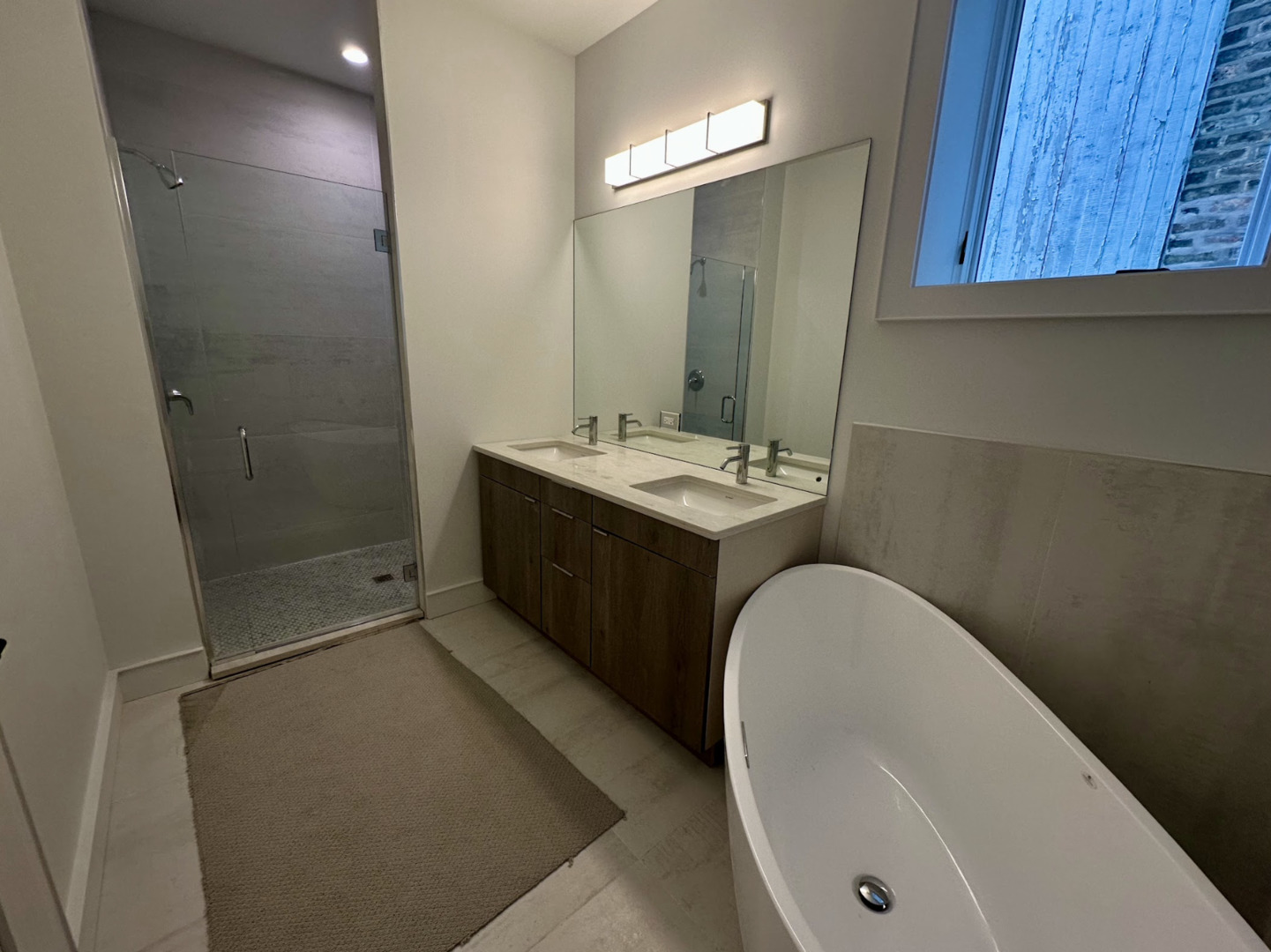 4243 North Damen Avenue, Unit 1R Chicago, IL 60618 - Photo 34 of 38 a bathroom with a tub sink and mirror