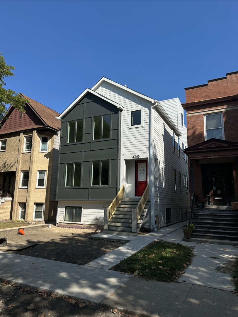 4243 North Damen Avenue, Unit 1R Chicago, IL 60618 - Photo 38 of 38 a front view of a house with street