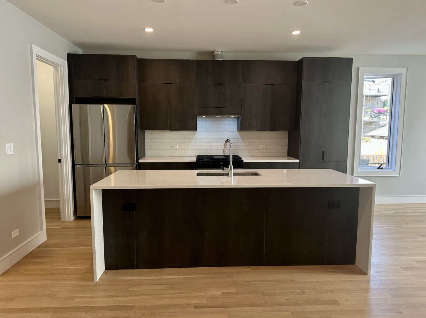 4243 North Damen Avenue, Unit 1R Chicago, IL 60618 - Photo 7 of 38 a view of kitchen with wooden floor