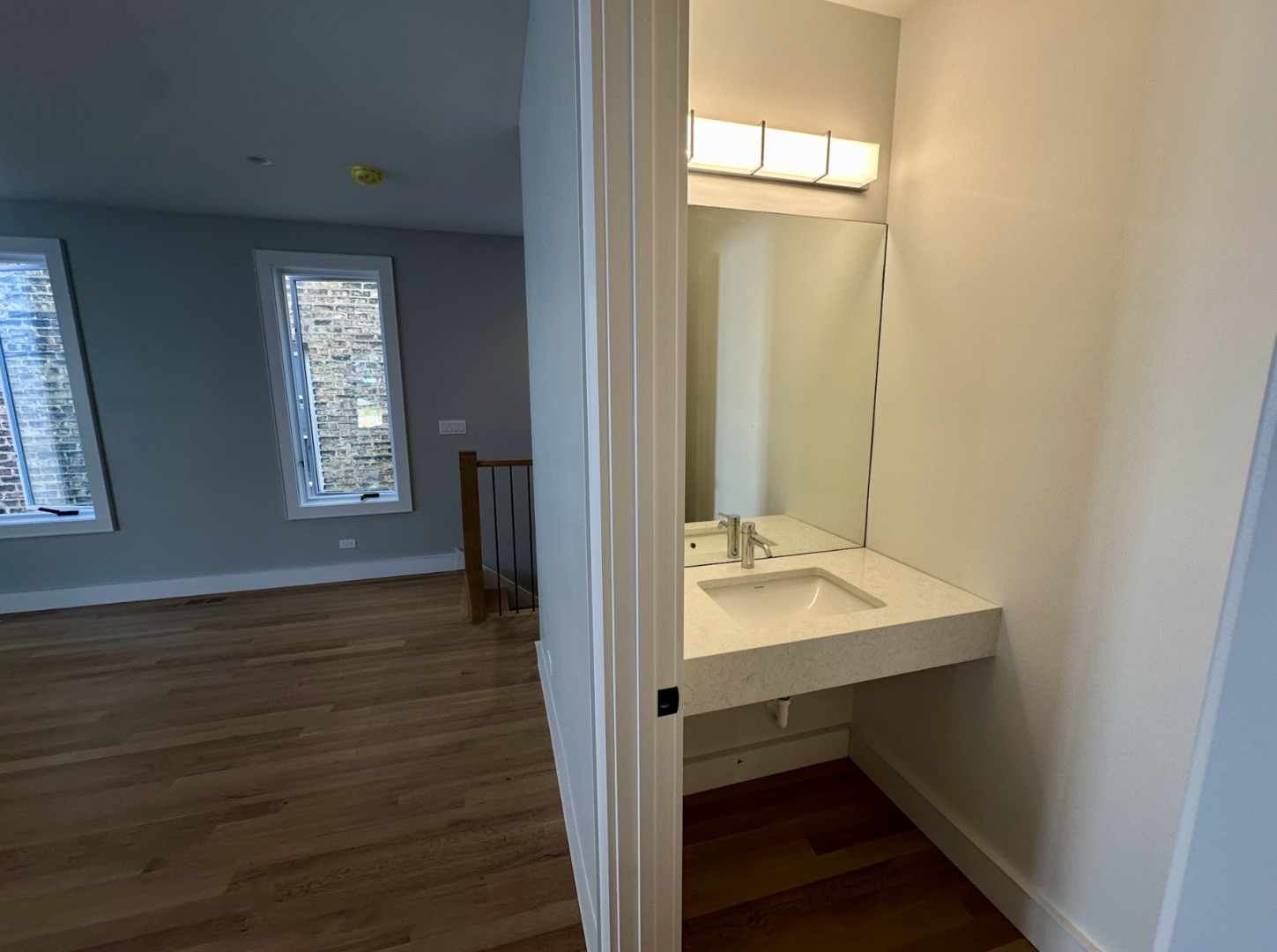 4243 North Damen Avenue, Unit 1R Chicago, IL 60618 - Photo 10 of 38 a view of an entryway with wooden floor and window