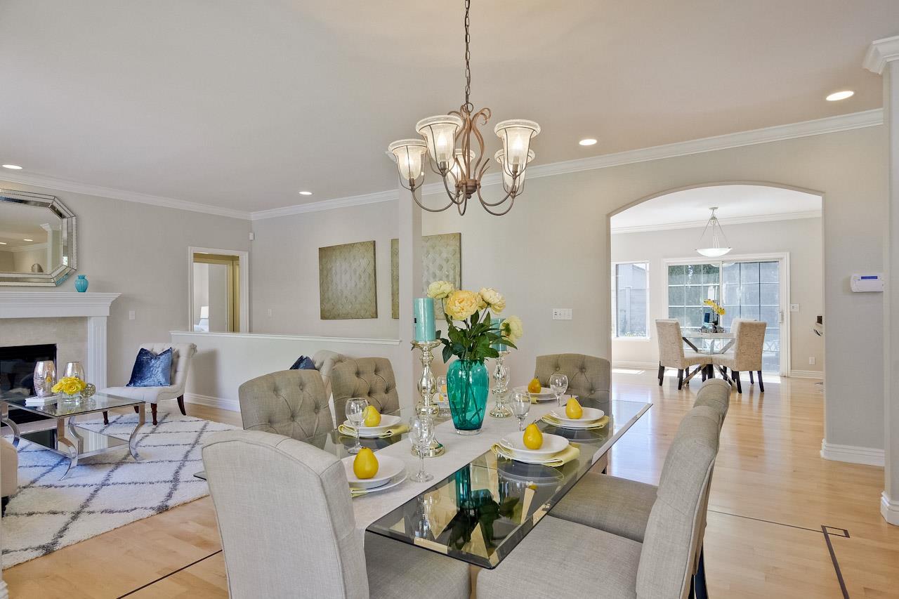 7648 Echo Hill Court Cupertino, CA 95014 - Photo 11 of 50 a living room with dining table and a chandelier