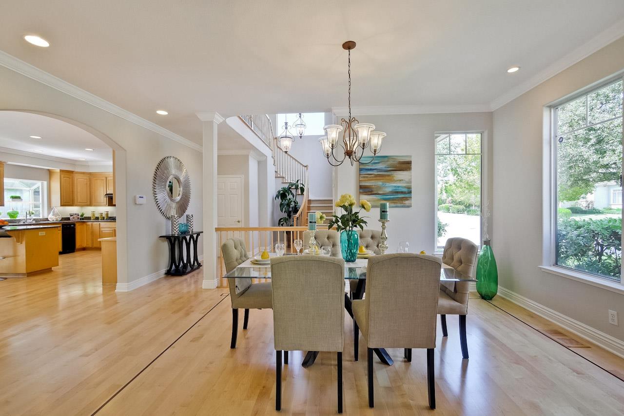 7648 Echo Hill Court Cupertino, CA 95014 - Photo 15 of 50 a view of a dining room and livingroom with furniture wooden floor a chandelier