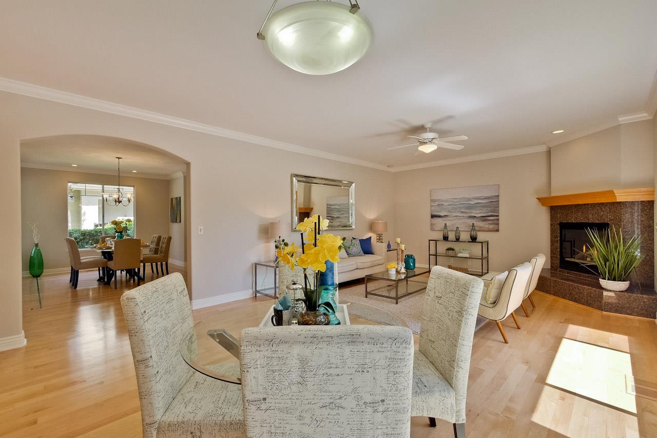 7648 Echo Hill Court Cupertino, CA 95014 - Photo 19 of 50 a living room with fireplace furniture and wooden floor