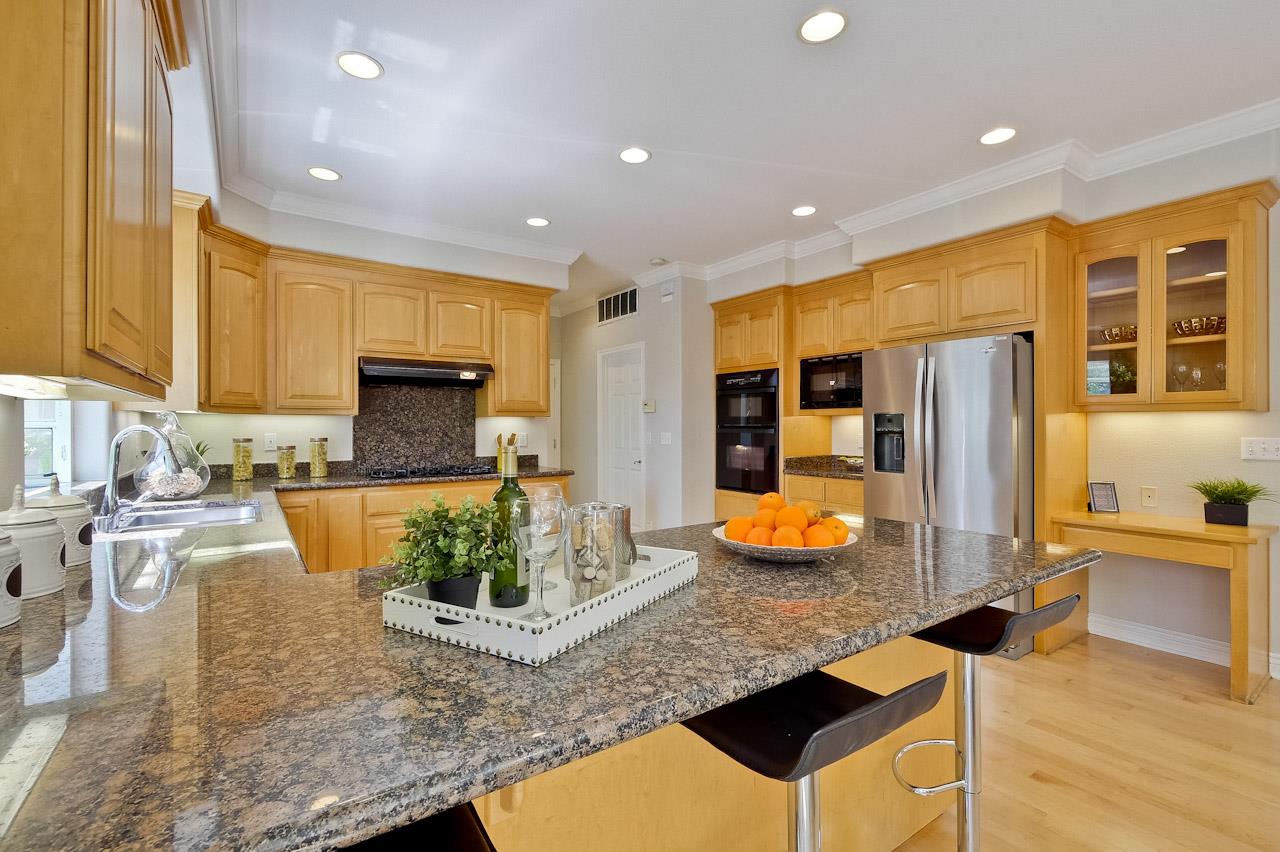 7648 Echo Hill Court Cupertino, CA 95014 - Photo 23 of 50 a kitchen with stainless steel appliances granite countertop a sink and a counter top space
