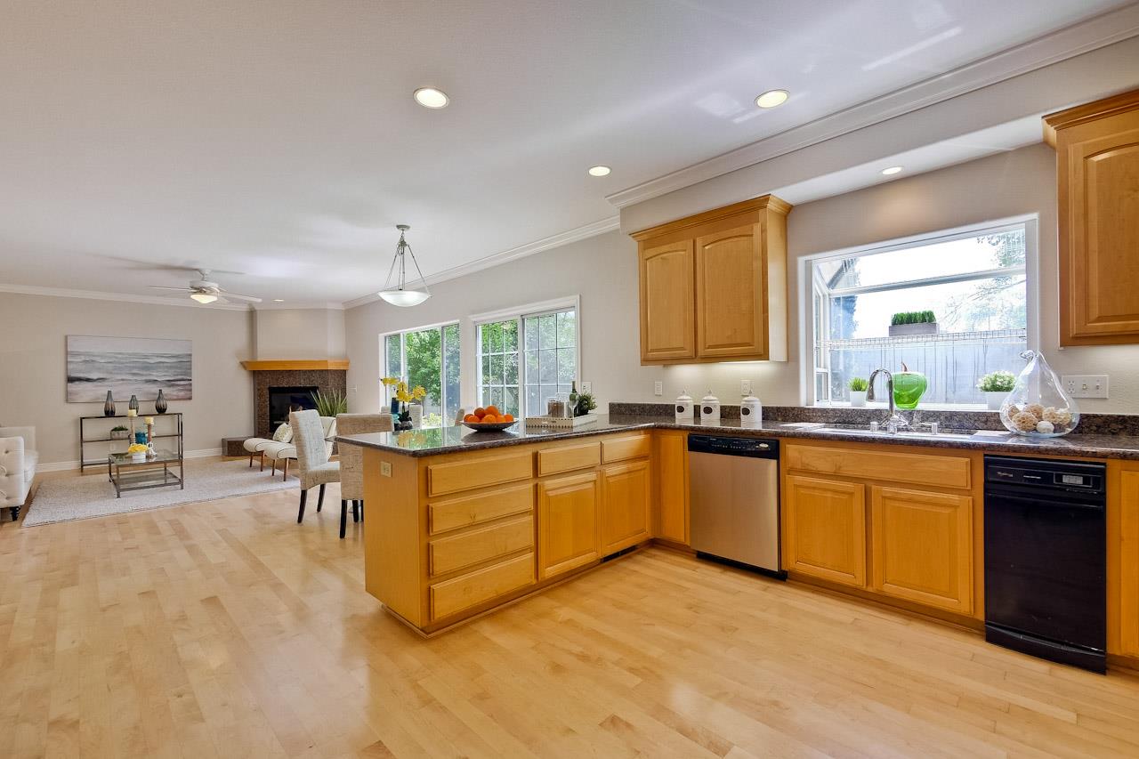 7648 Echo Hill Court Cupertino, CA 95014 - Photo 25 of 50 a kitchen with stainless steel appliances granite countertop sink stove top oven and cabinets