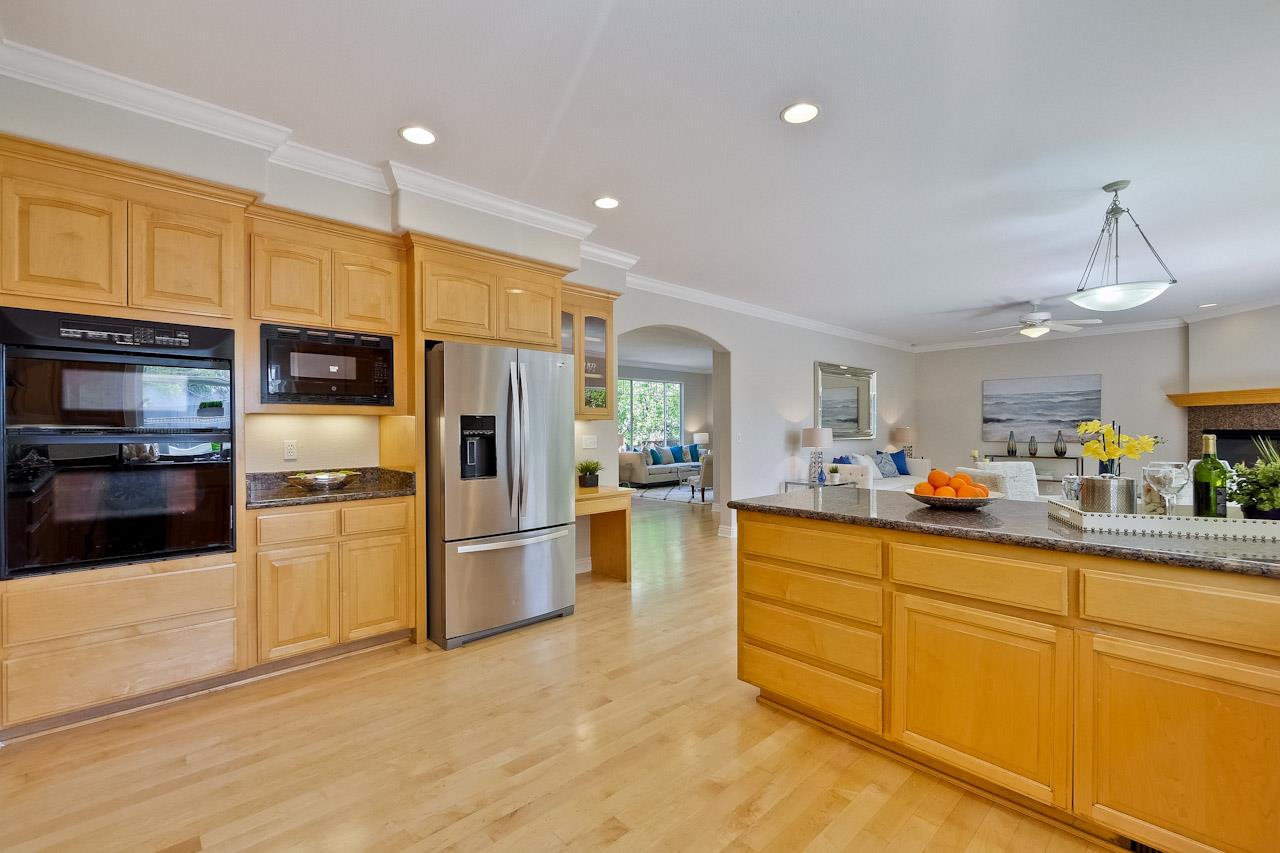 7648 Echo Hill Court Cupertino, CA 95014 - Photo 26 of 50 a kitchen with stainless steel appliances a refrigerator and a stove top oven