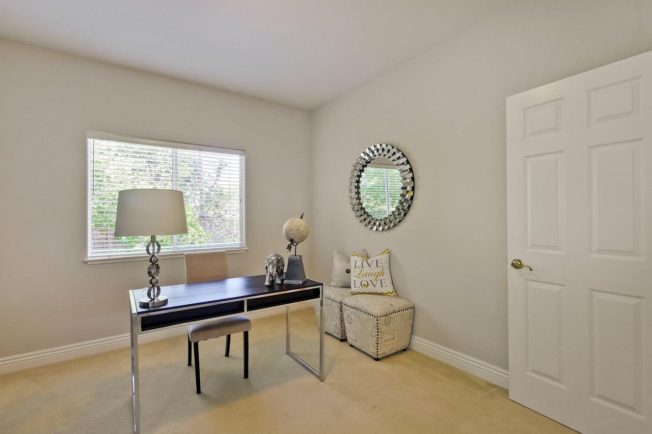 7648 Echo Hill Court Cupertino, CA 95014 - Photo 36 of 50 a living room with furniture a window and a table