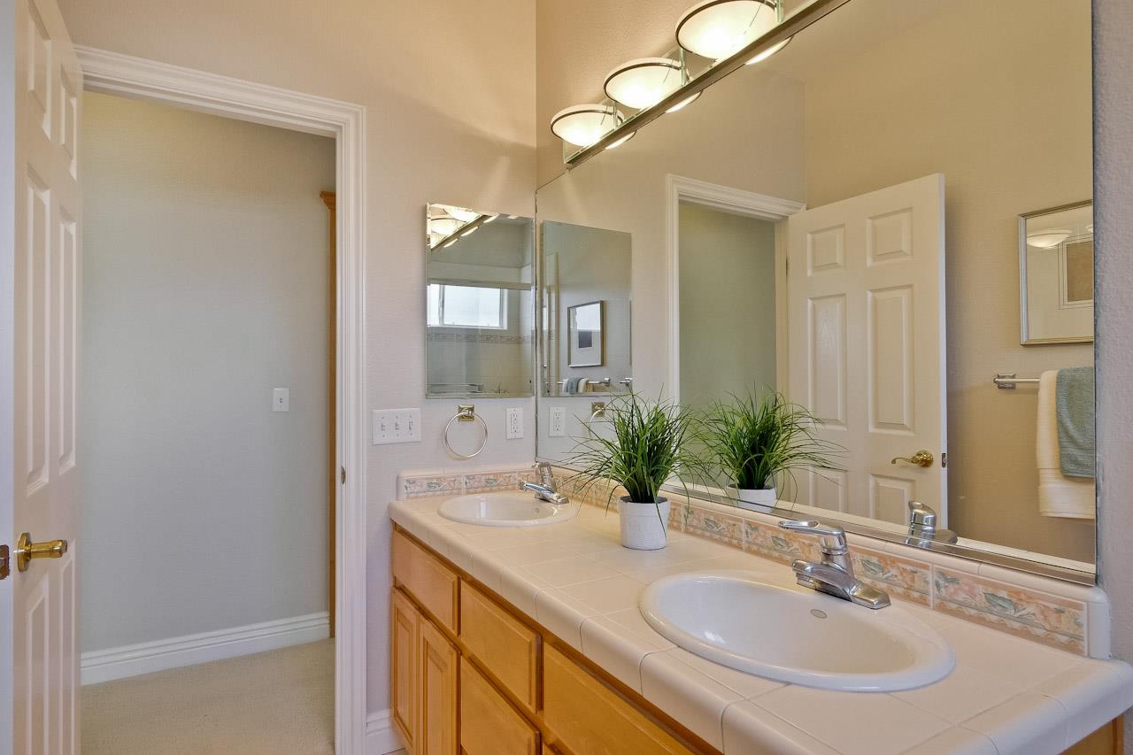 7648 Echo Hill Court Cupertino, CA 95014 - Photo 46 of 50 a bathroom with a sink and a mirror