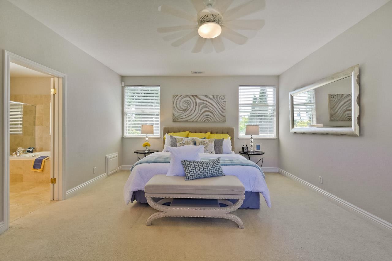 7648 Echo Hill Court Cupertino, CA 95014 - Photo 49 of 50 a bedroom with a bed and wooden floor