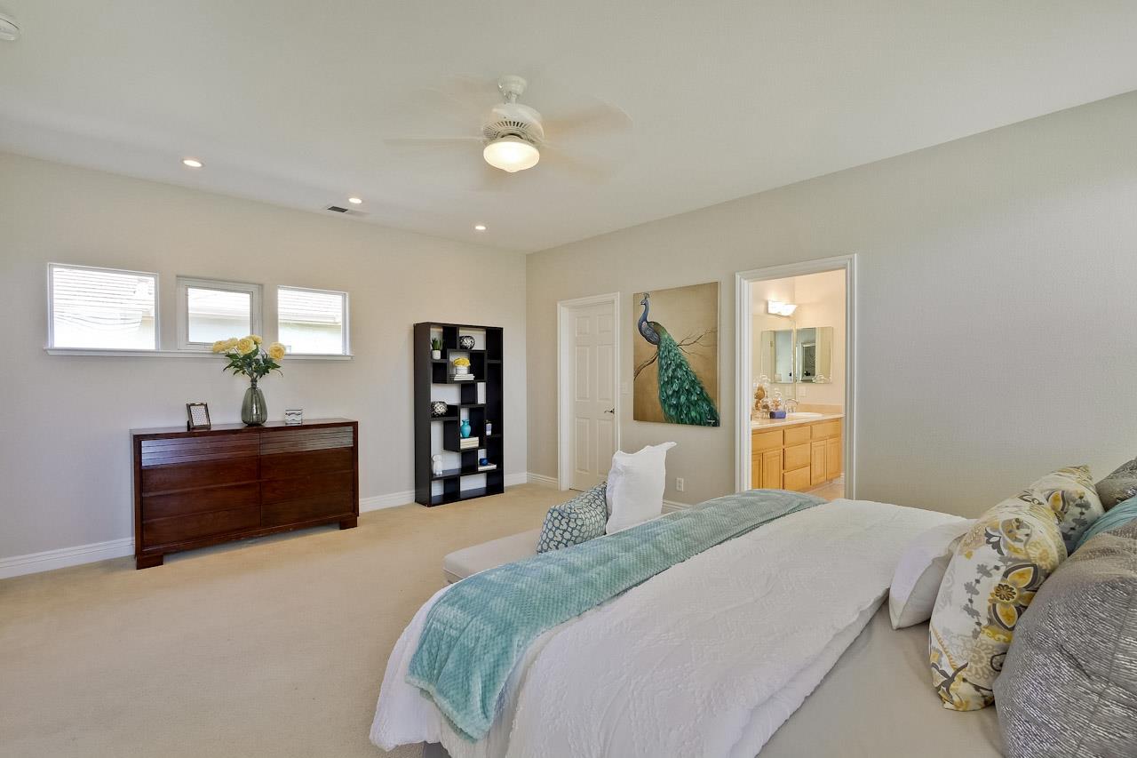 7648 Echo Hill Court Cupertino, CA 95014 - Photo 50 of 50 a bed room with a bed and a potted plant