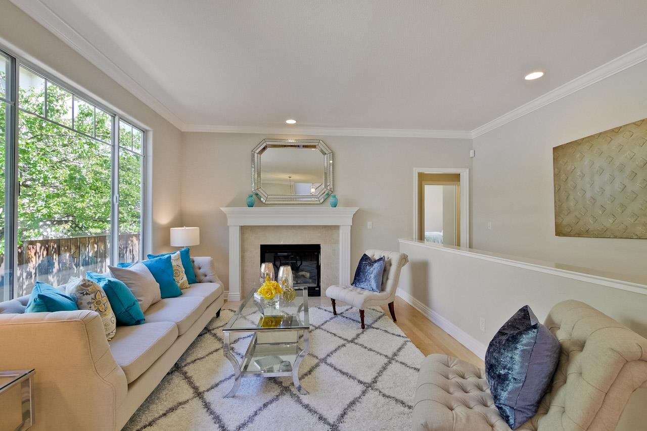 7648 Echo Hill Court Cupertino, CA 95014 - Photo 6 of 50 a living room with furniture and a fireplace