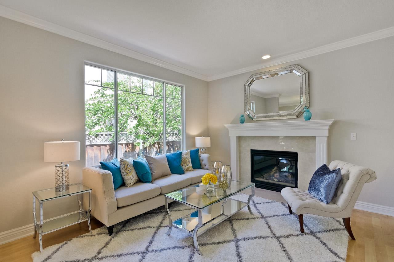 7648 Echo Hill Court Cupertino, CA 95014 - Photo 7 of 50 a living room with furniture and a fireplace