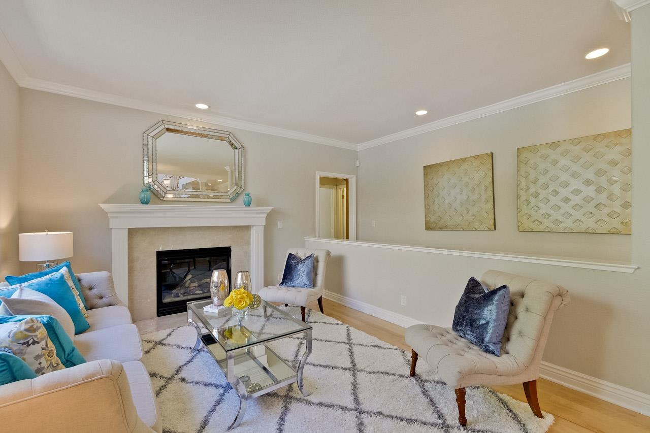 7648 Echo Hill Court Cupertino, CA 95014 - Photo 9 of 50 a living room with furniture and a fireplace