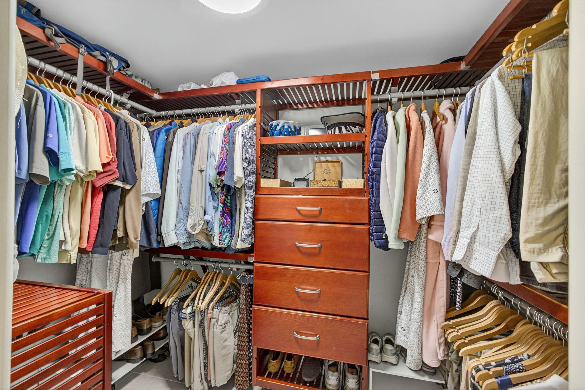 129 South Golfview Road, Unit 7 Lake Worth Beach, FL 33460 - Photo 39 of 79 a view of walk in closet with clothes and shoes