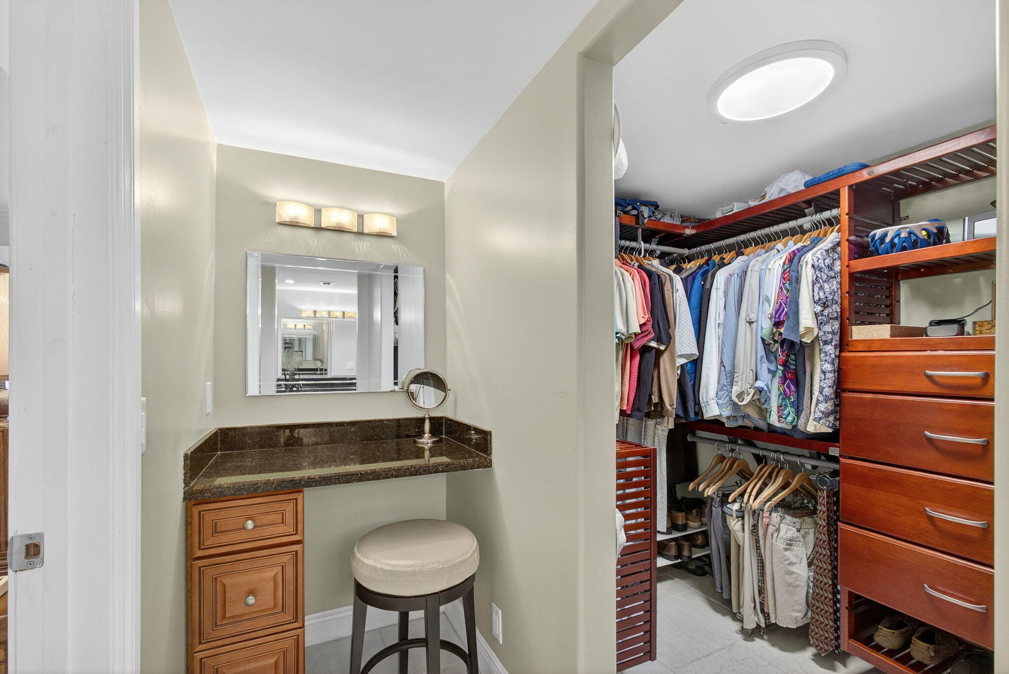 129 South Golfview Road, Unit 7 Lake Worth Beach, FL 33460 - Photo 40 of 79 a view of walk in closet with clothes and shoes