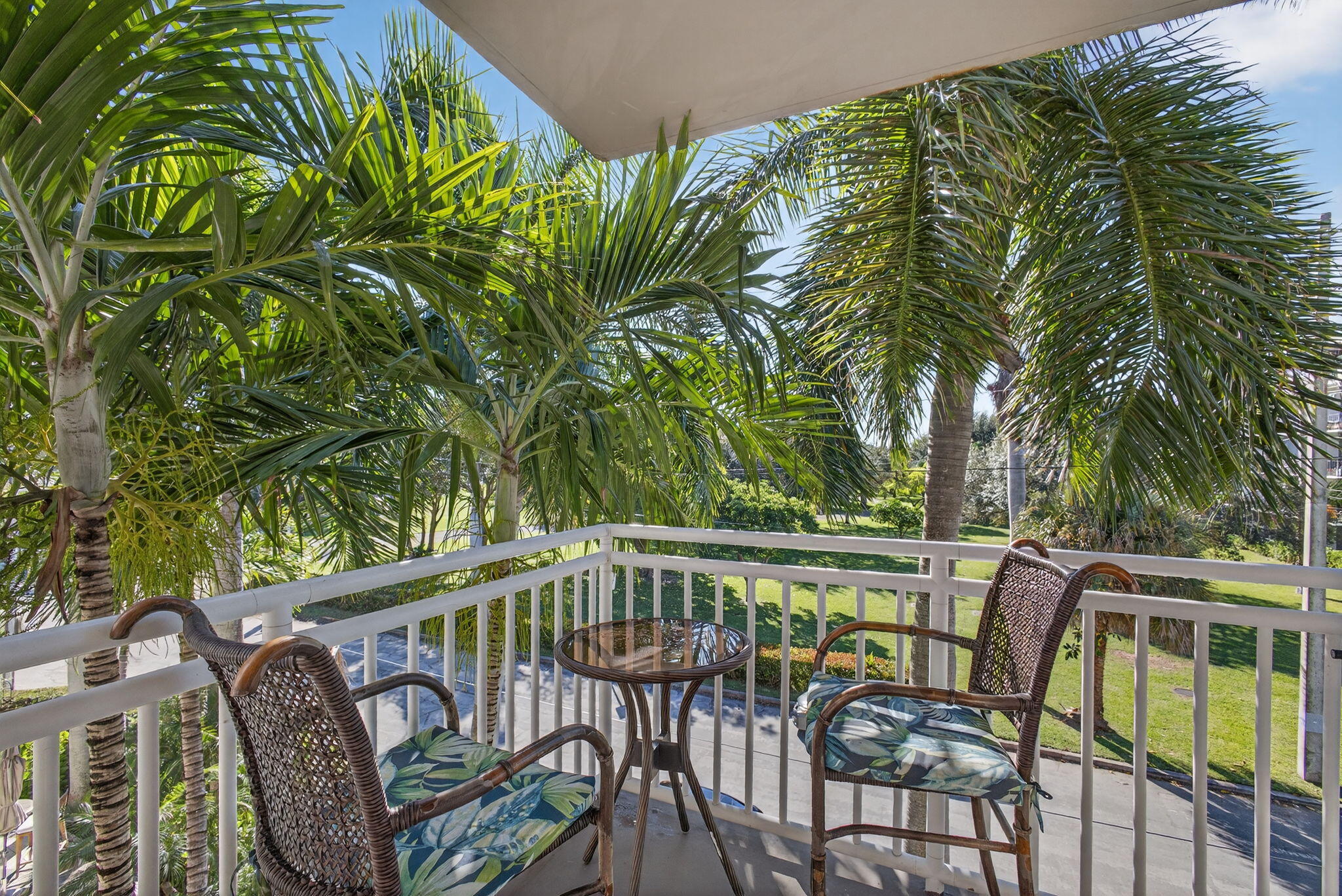 129 South Golfview Road, Unit 7 Lake Worth Beach, FL 33460 - Photo 50 of 79 a view of a chair and table in the balcony