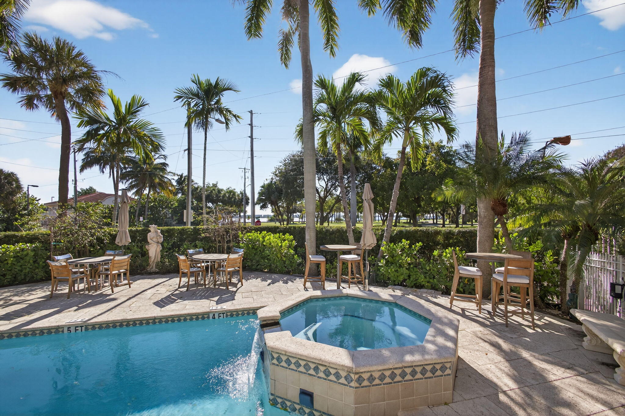 129 South Golfview Road, Unit 7 Lake Worth Beach, FL 33460 - Photo 51 of 79 a view of swimming pool with outdoor seating and plants