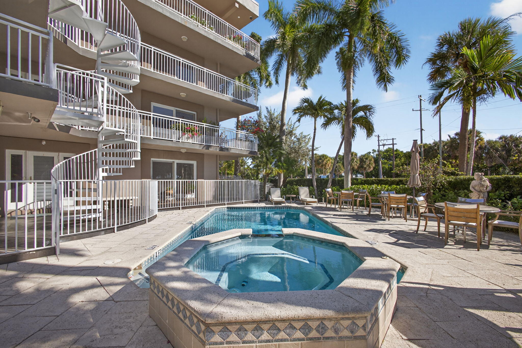 129 South Golfview Road, Unit 7 Lake Worth Beach, FL 33460 - Photo 52 of 79 a view of outdoor space with swimming pool and lounge chair