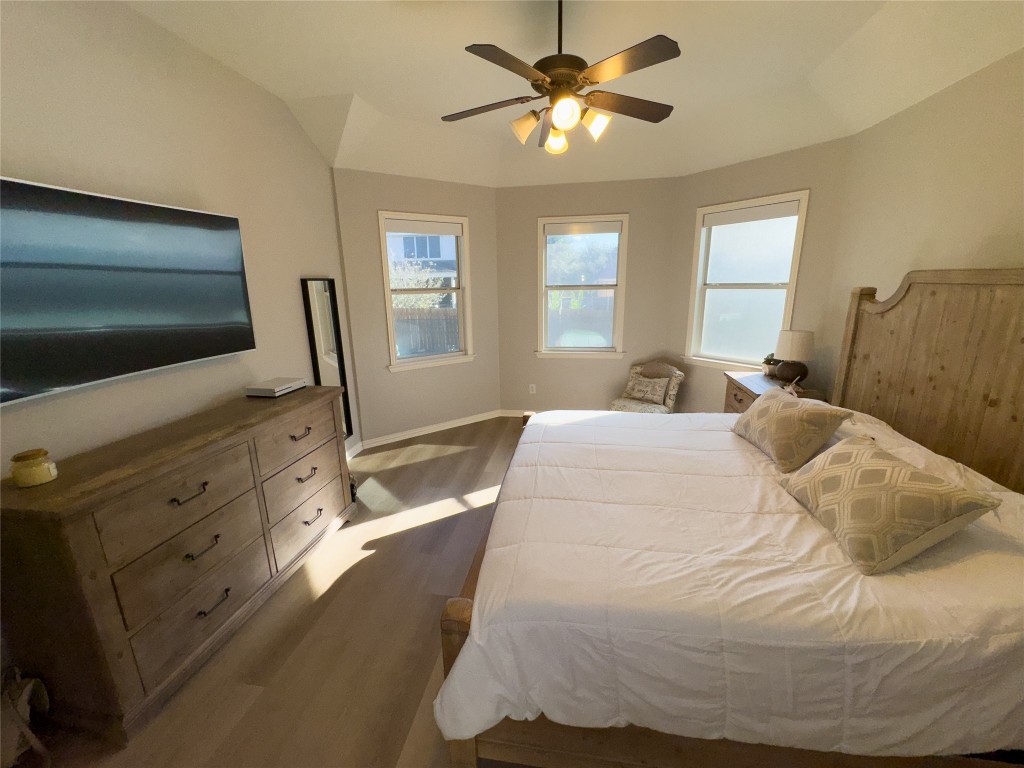 2410 Aspen Meadow Road Leander, TX 78641 - Photo 11 of 24 a bedroom with a bed and a flat screen tv