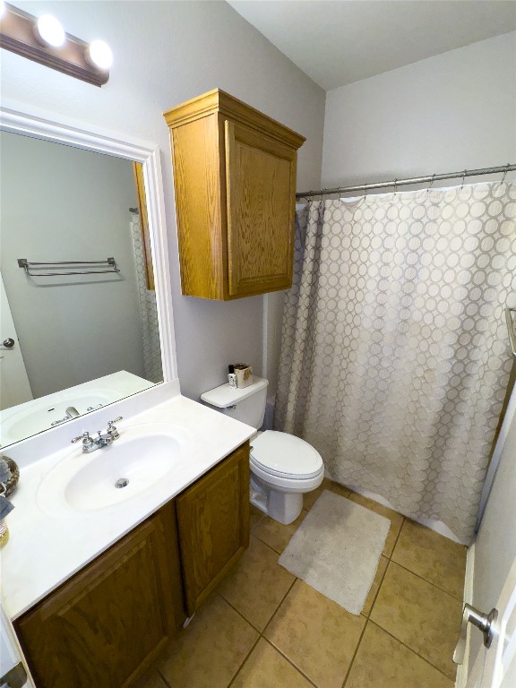 2410 Aspen Meadow Road Leander, TX 78641 - Photo 14 of 24 a bathroom with a sink a toilet and mirror