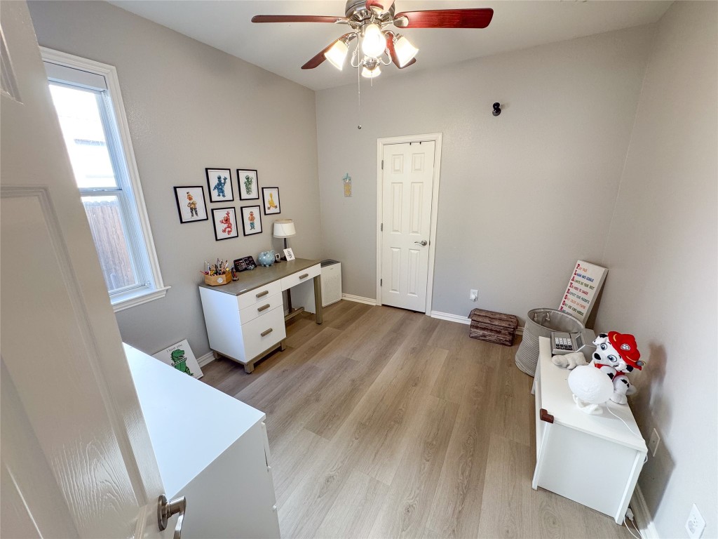 2410 Aspen Meadow Road Leander, TX 78641 - Photo 18 of 24 a living room with furniture and a wooden floor
