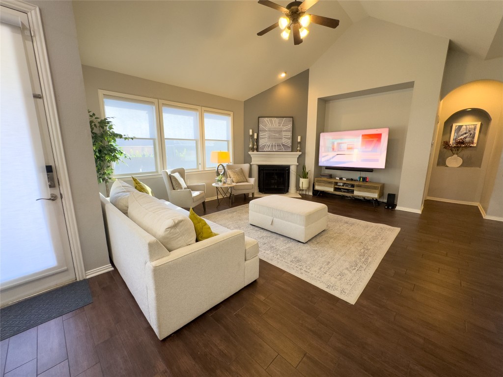 2410 Aspen Meadow Road Leander, TX 78641 - Photo 5 of 24 a living room with fireplace furniture and a flat screen tv