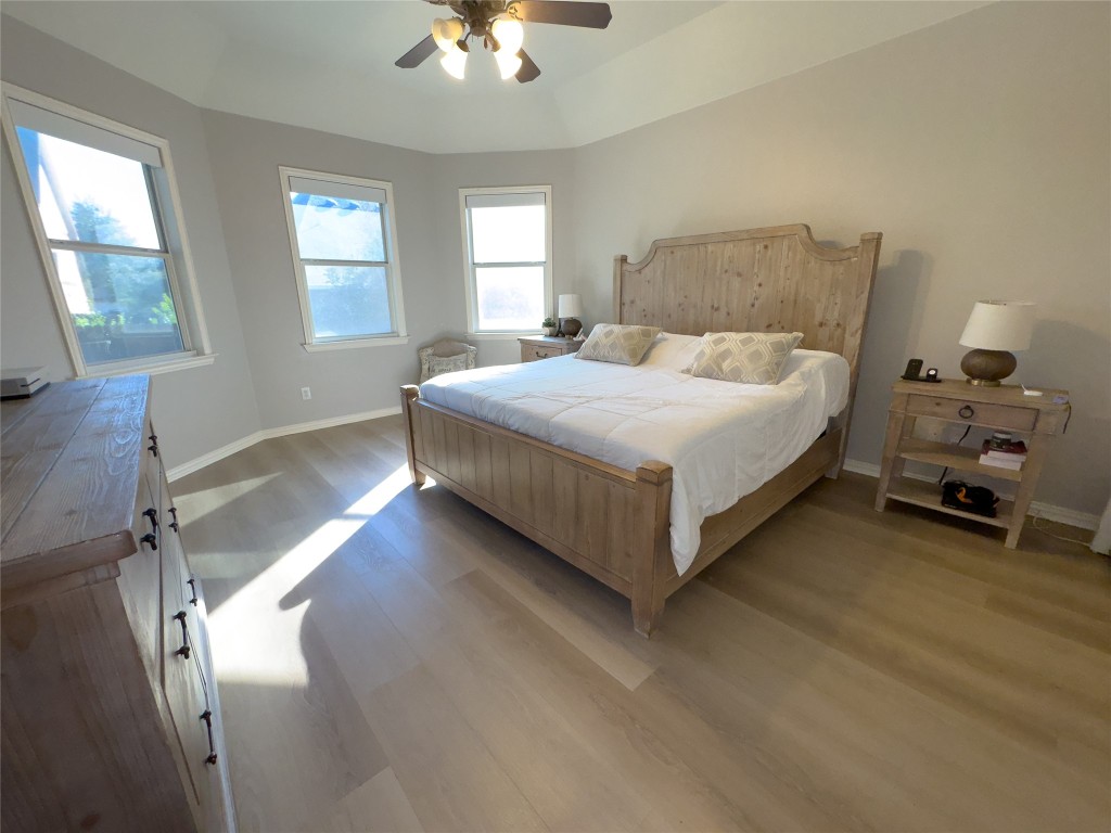 2410 Aspen Meadow Road Leander, TX 78641 - Photo 10 of 24 a spacious bedroom with a bed and a window