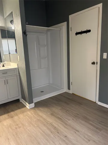 an empty room with a empty space and a ceiling fan