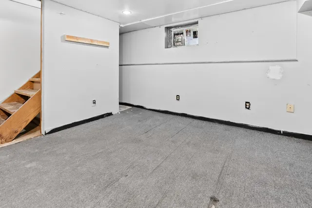 a view of a house with wooden fence