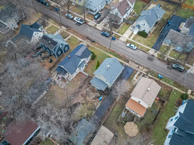 an aerial view of residential house with outdoor space