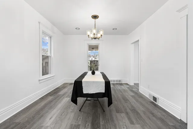 a workspace room with furniture and wooden floor
