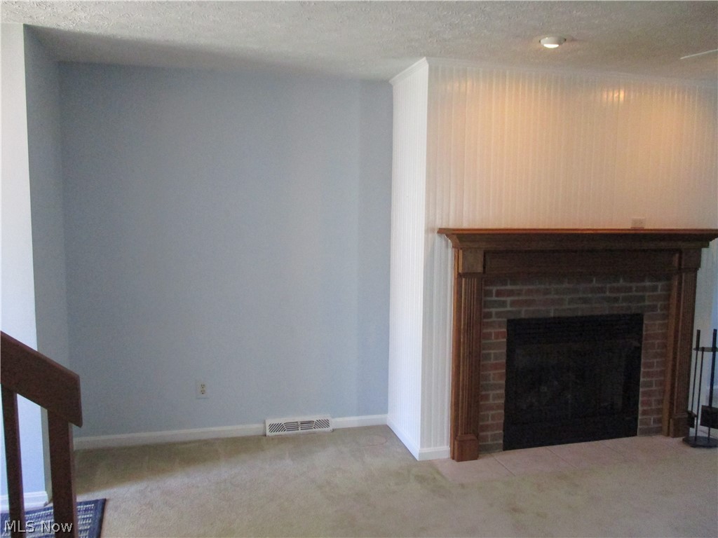 1884 Lillian Road Stow, OH 44224 - Photo 4 of 31 Plenty of room on both sides of the fireplace for furniture, shelving or a TV and stand.